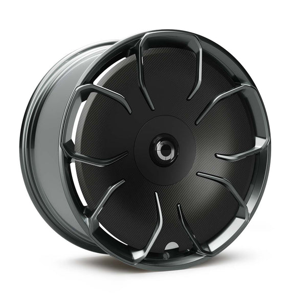 The New Aero CHELA in Glossy Titanium mit Satin-Carbon-Aerodisc, Schrägansicht der Flow-Formed-Felge mit Carbondetails.