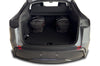 Zwei KJUST Sport Bags aus dem Kofferraumtaschen Set TESLA MODEL Y Juniper 2025+ optimal positioniert im hinteren Bereich des Fahrzeugs.