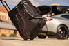 Detailaufnahme einer KJUST Trolley Bag aus dem Kofferraumtaschen Set TESLA MODEL Y Juniper 2025+ mit leichtgängigen Rollen und stabiler Bauweise.