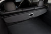 Innenansicht der eingerollten Kofferraumabdeckung Model Y Juniper 2025+, perfekt abgestimmt auf das Tesla Interieur in Schwarz.