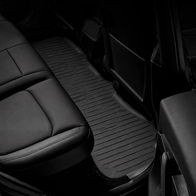 Tesla Fußmatten Model Y Juniper Standard für den Fond aus einem Stück, passgenau um Mittelkonsole und Sitzbereich für vollständigen Bodenschutz.