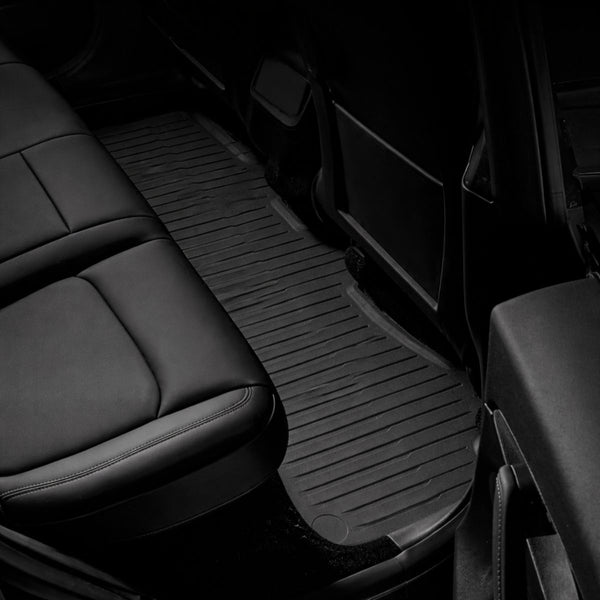 Tesla Fußmatten Model Y Juniper Standard für den Fond aus einem Stück, passgenau um Mittelkonsole und Sitzbereich für vollständigen Bodenschutz.