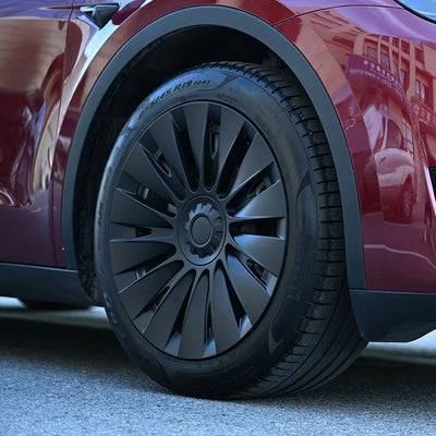 Tesla Model Y Radkappen Schwarz 19 Zoll Blades montiert auf Gemini-Felgen mit sportlichem Finish und perfekter Passform für das Model Y.